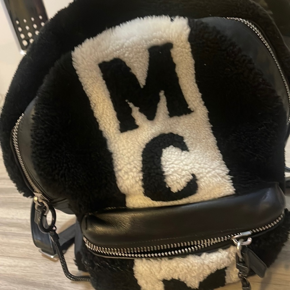 MCM leather backpack with fuzzy outside. Worn a few times. Men or women
